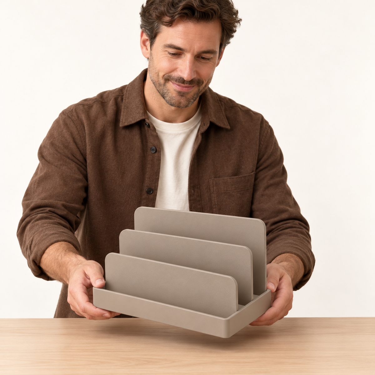 Desktop letter sorter held by adult man