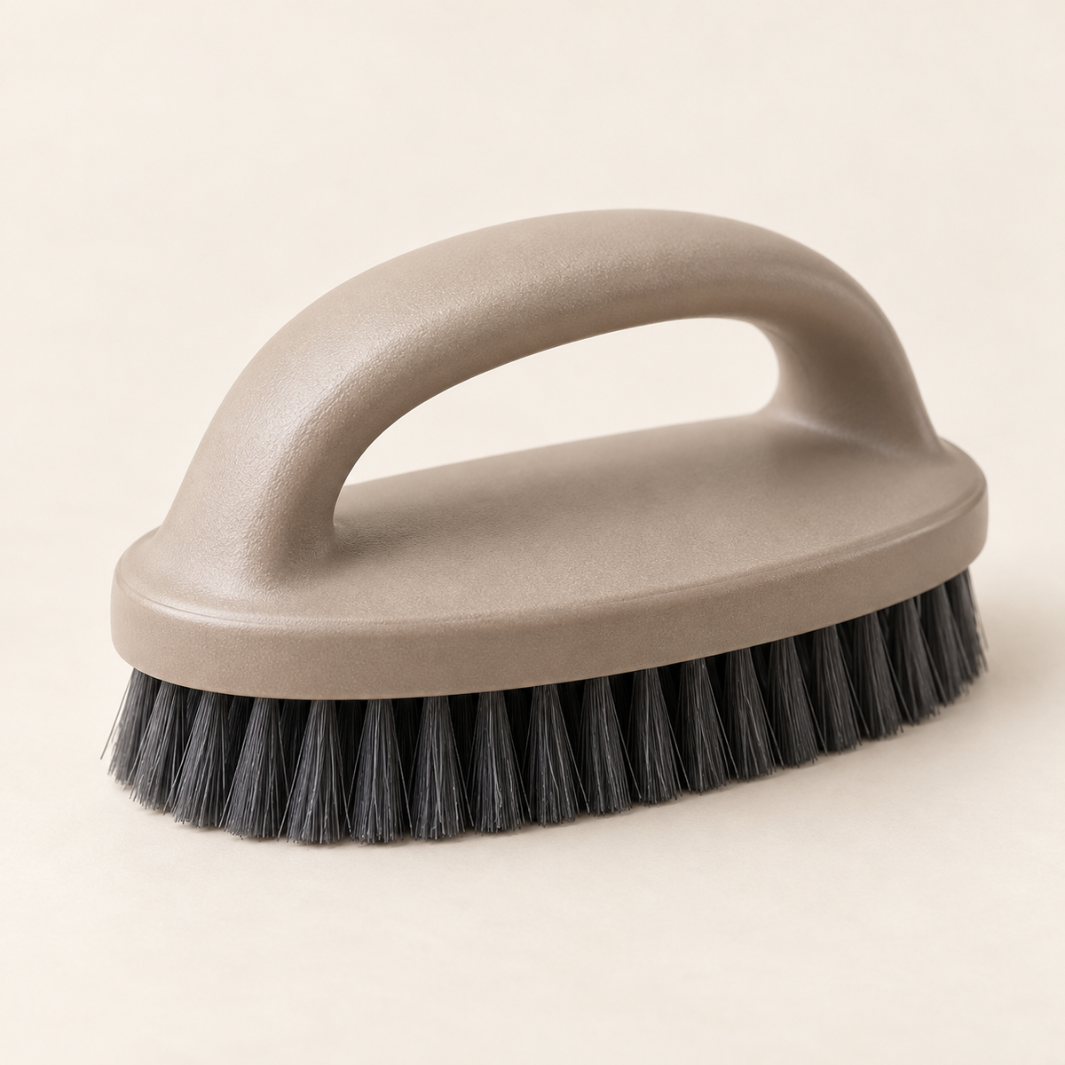 handheld upholstery brush — studio product view